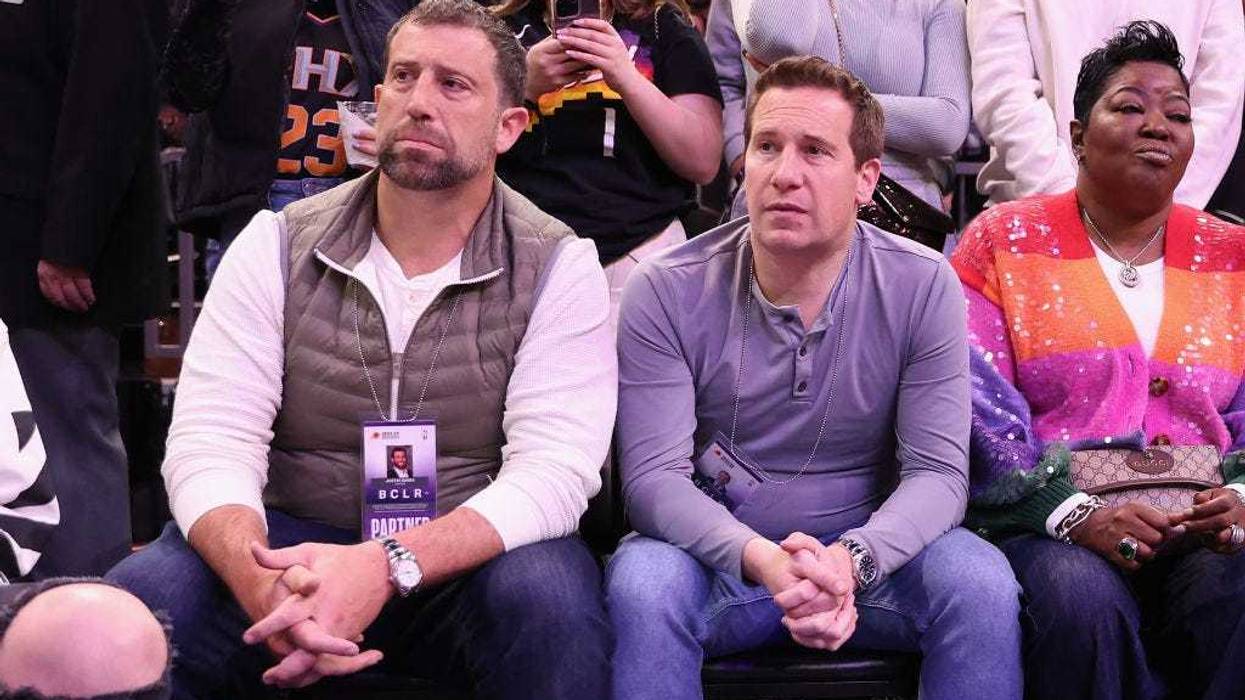 Phoenix Suns co-owner Justin Ishbia (left) looks on during the first half of the NBA game against the LA Clippers at Footprint Center on February 16, 2023 in Phoenix, Arizona.
