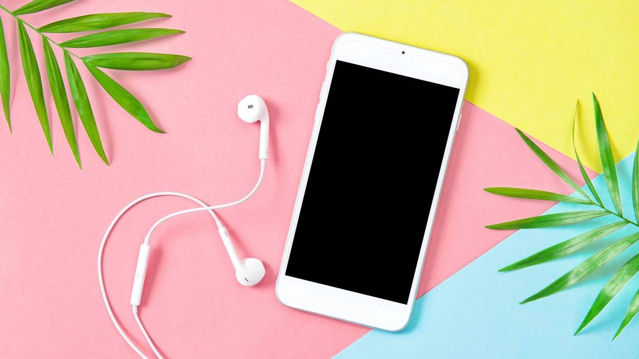 phone on a pastel background with plants