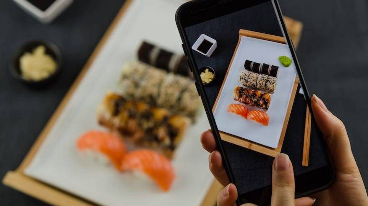 Phone taking picture of sushi