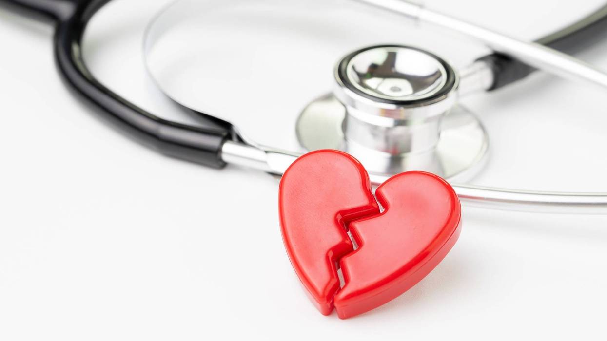 Photo of a broken heart with a stethoscope in the background.