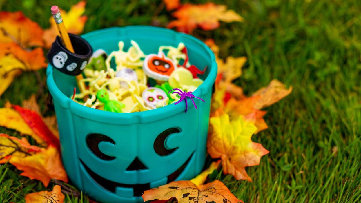 Photo of a teal pumpkin container full of non-food treats for children with food allergies who Trick or Treat