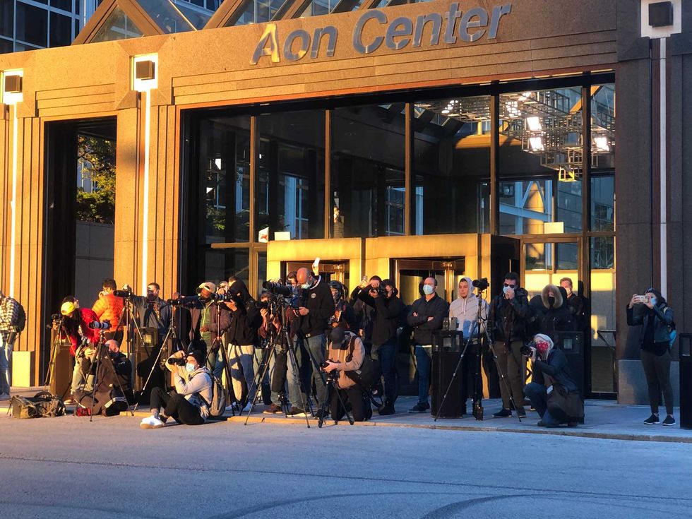 Photographers - professionals and amateurs - were seen all over downtown between 6 p.m. and 7 p.m. on Saturday to try and get the perfect shot of a rare phenomenon - the dramatic alignment of the setting sun and Chicago