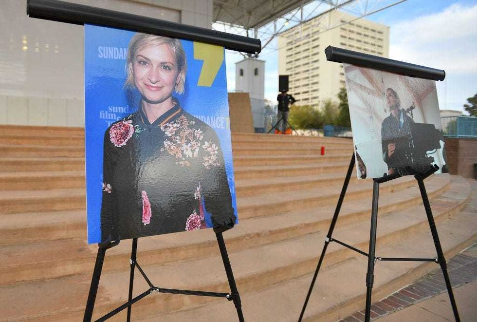 Photos of cinematographer Halyna Hutchins are displayed before a vigil held to honor her at Albuquerque Civic Plaza on October 23, 2021 in Albuquerque, New Mexico. Hutchins was killed on set while filming the movie "Rust" at Bonanza Creek Ranch near Santa Fe, New Mexico on October 21, 2021. The film