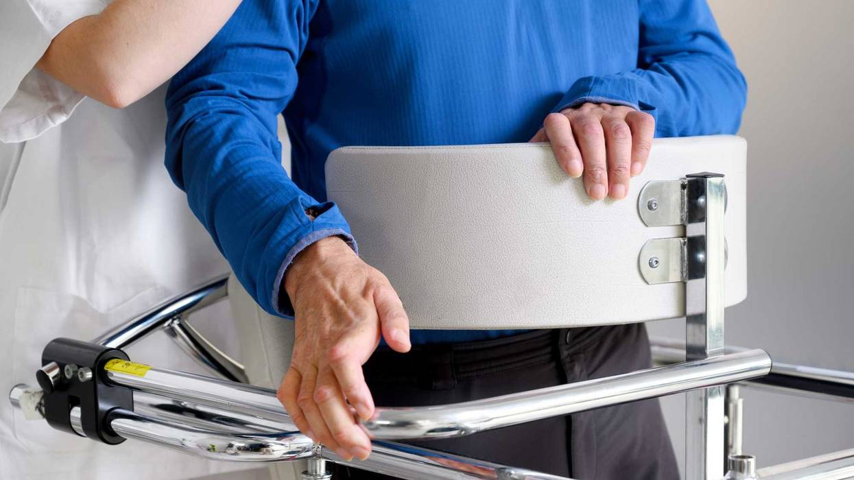 Physiotherapist assisting a patient with Amyotrophic Lateral Sclerosis.