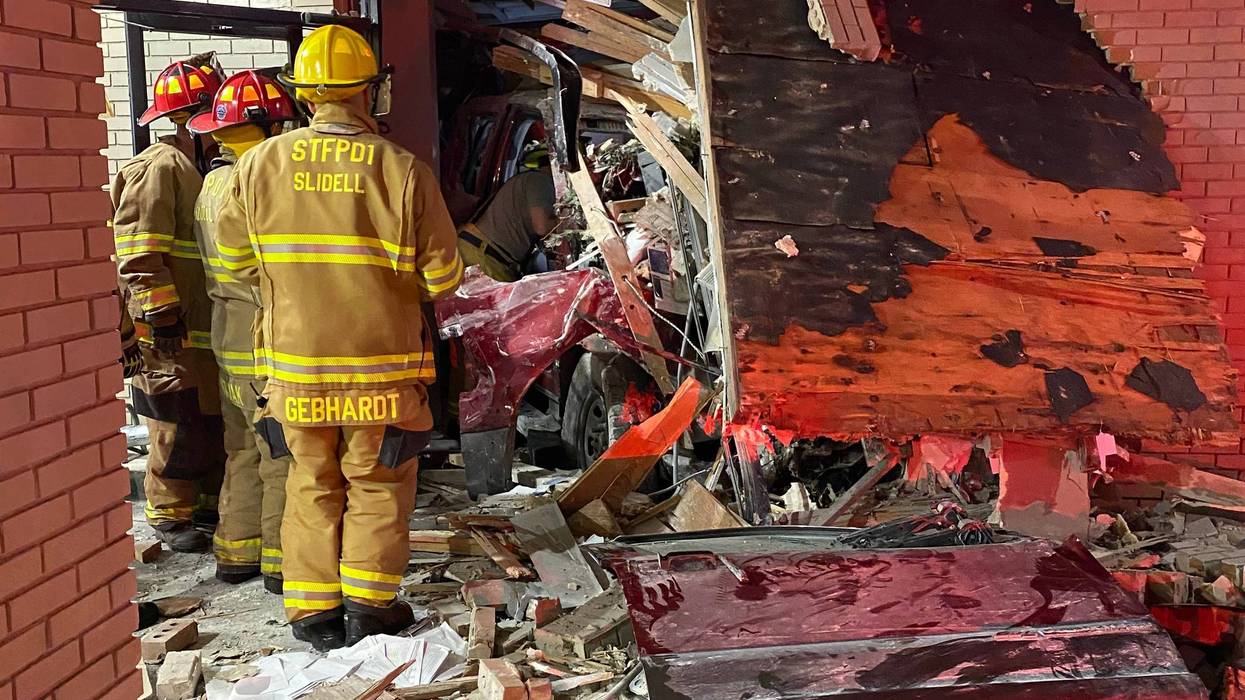 Pickup driver dies after slamming into credit union building