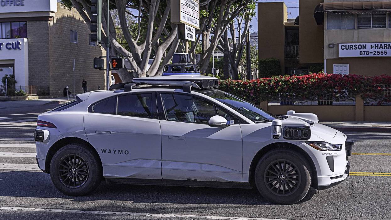 picture of a Waymo car on the street