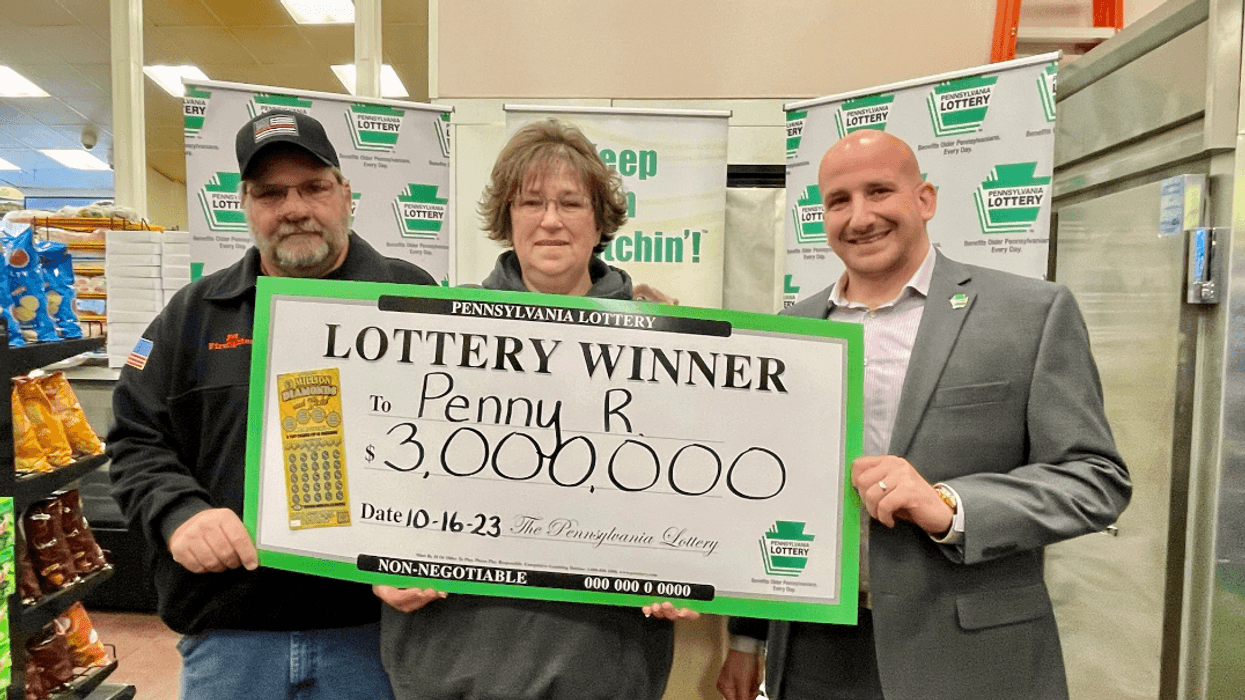 Pictured left to right: Pat Reep, Penny Reep, PA Lottery Area Sales Manager AJ Kaye