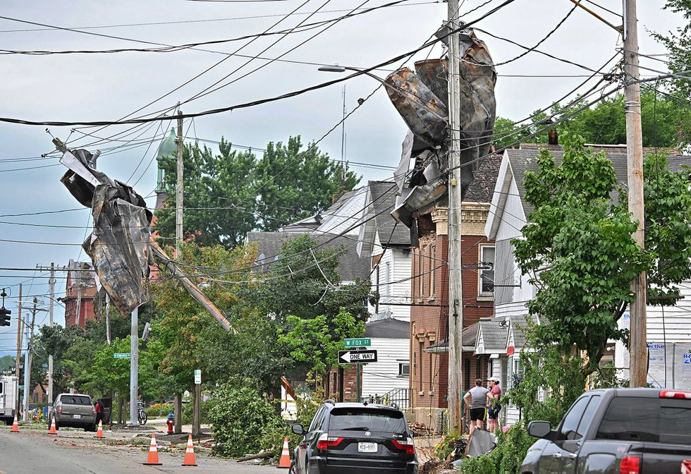 Pieces of the copper roofing from the First Presbyterian Church are wrapped around utility poles almost a quarter mile away from the church that was struck by a tornado, in Rome, N.Y., Tuesday, July 16, 2024