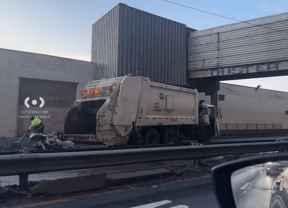 Pieces of the Tesla were being cleaned up by Sanitation crews after daybreak on Feb. 4, 2025