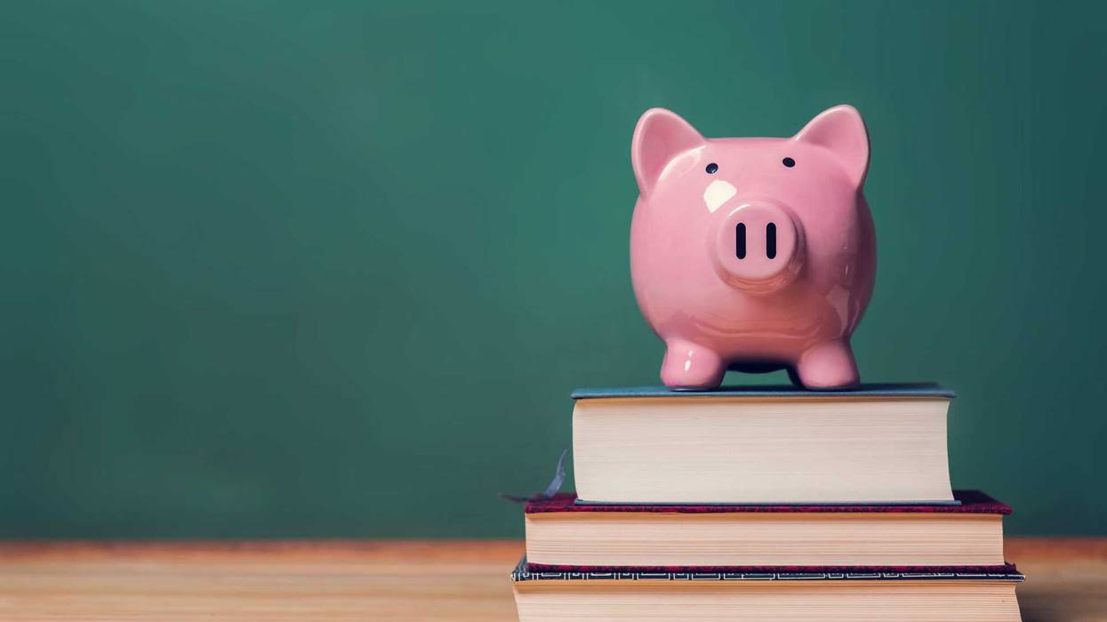 Piggy bank on top of books