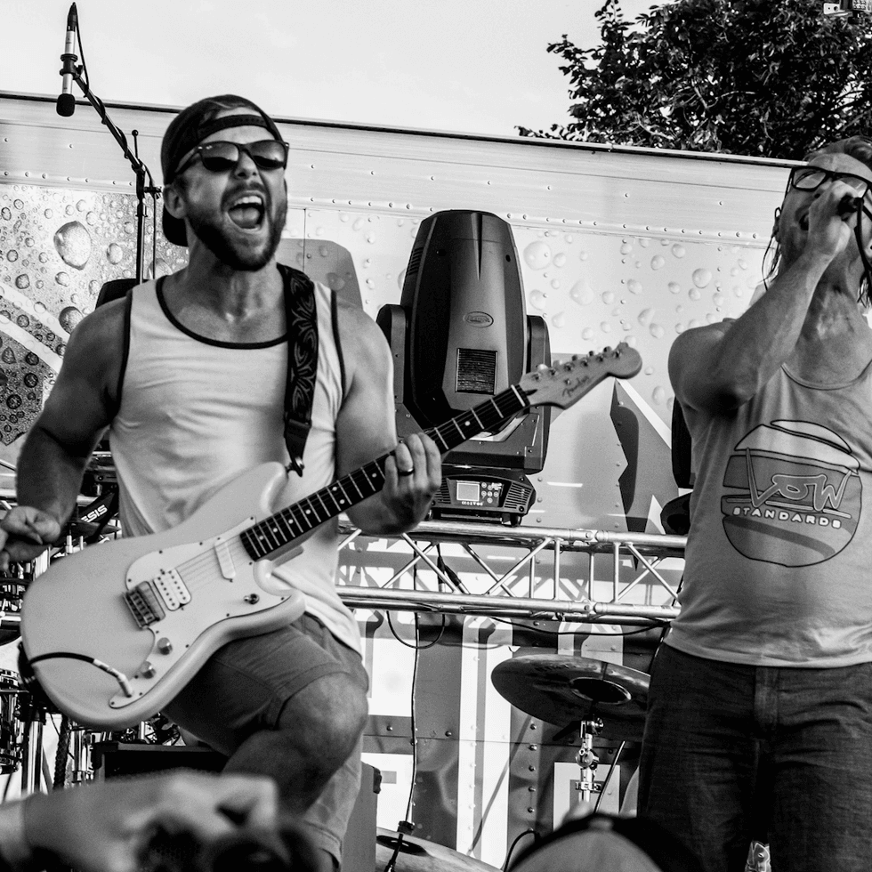 Pike playing guitar in his band