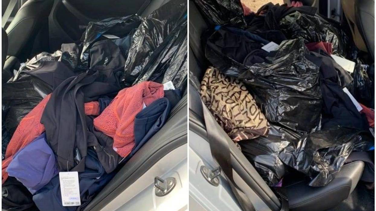 piles of clothes in car