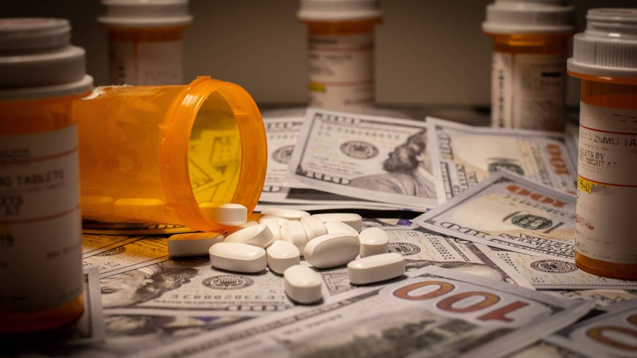 pill bottles and hundred dollar bills