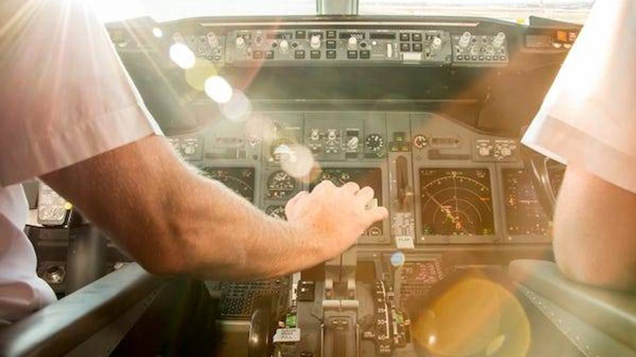 Pilots in cockpit before takeoff