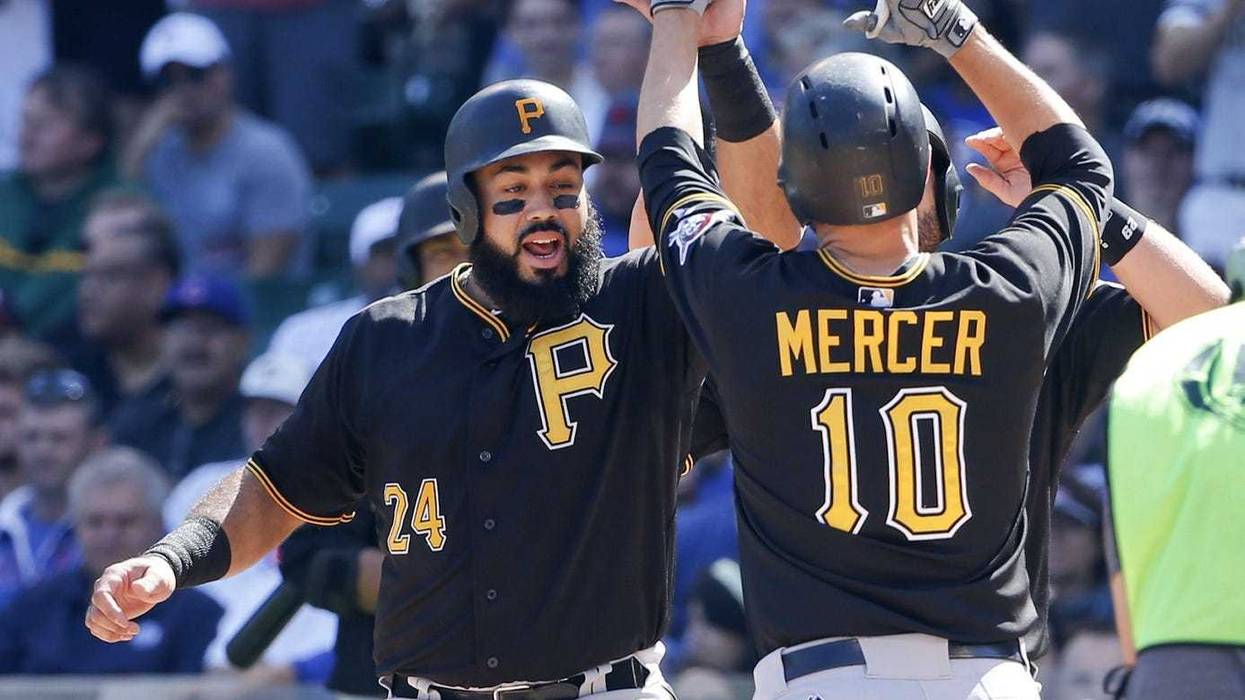 Pirates first baseman Pedro Alvarez (24) celebrates with shortstop Jordy Mercer