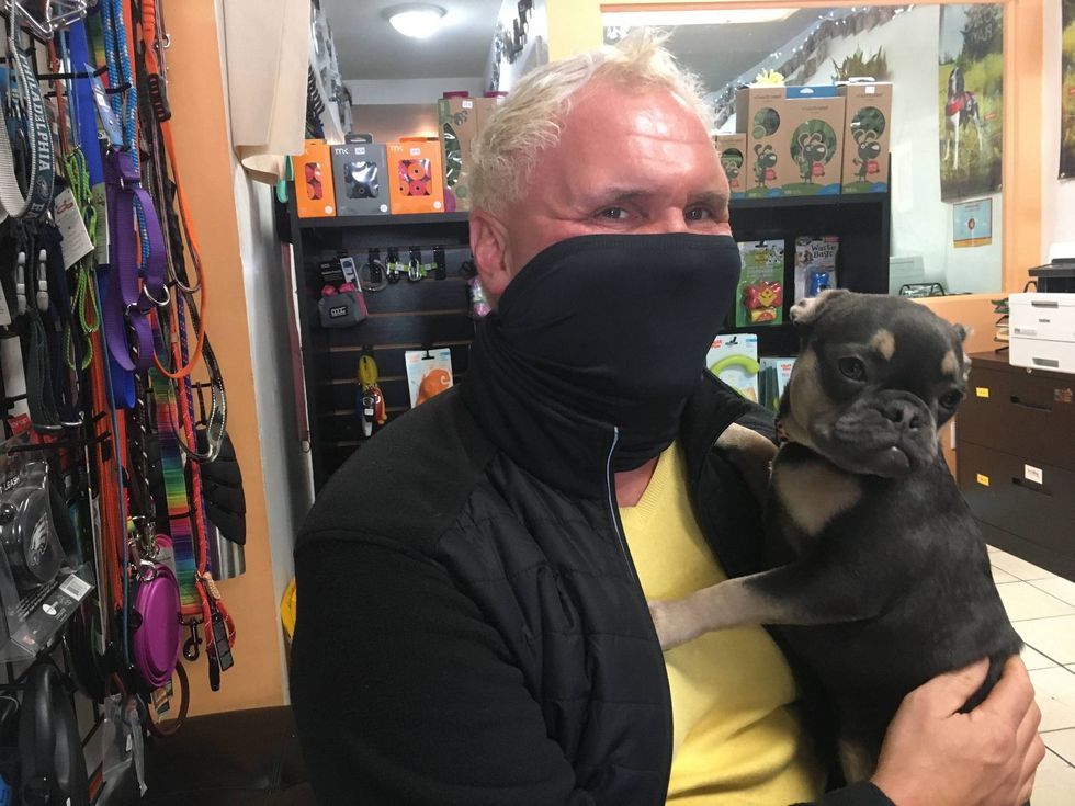 Pit Stop HQ employee Brian Heiss, with a canine client