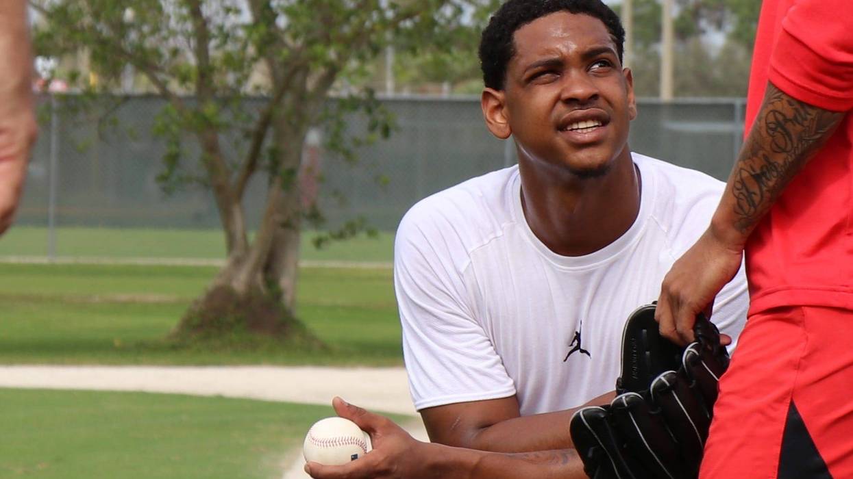 Pitcher Alex Reyes watches his teammates' throw bullpens during Cardinals spring training