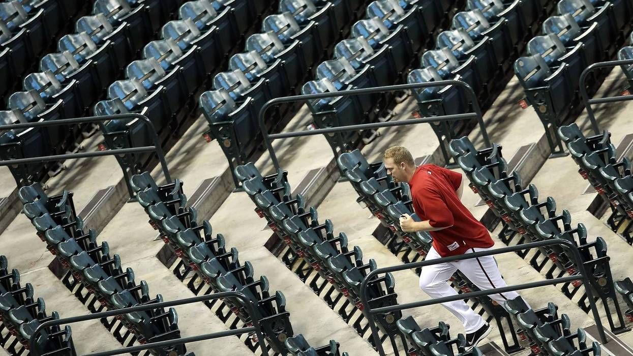 Pitcher J.J. Putz #40 of the Arizona Diamondbacks runs the stairs before Game Four of the National League Division Series against the Milwaukee Brewers at Chase Field on October 5, 2011