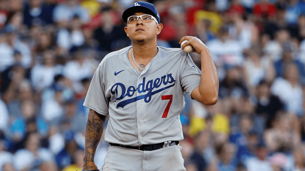 Pitcher Julio Urias #7 of the Los Angeles Dodgers stands on the mound after giving up a three-run home run to the Boston Red Sox during the sixth inning at Fenway Park on August 26, 2023 in Boston, Massachusetts.