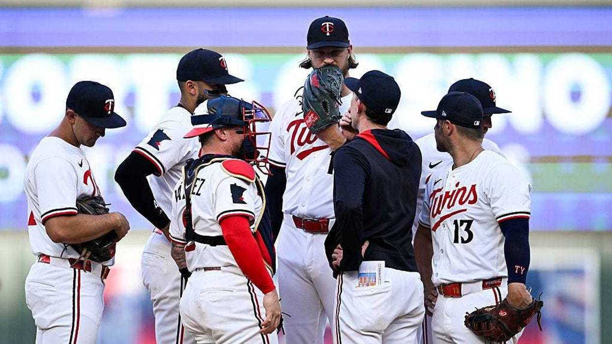 Pitching coach Pete Maki #88 of the Minnesota Twins visits Bailey Ober #17 on the mound in the third inning of the game against the Seattle Mariners at Target Field on June 23, 2025 in Minneapolis, Minnesota.