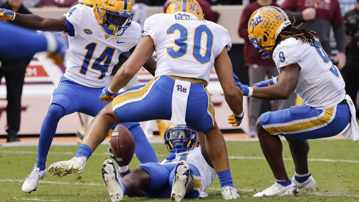 Pitt celebrating interception by Erick Hallett