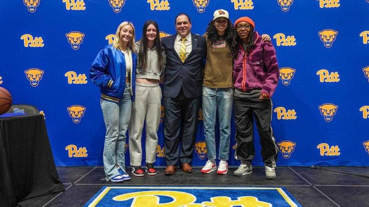 Pitt women's basketball coach Tory Verdi with Panthers players