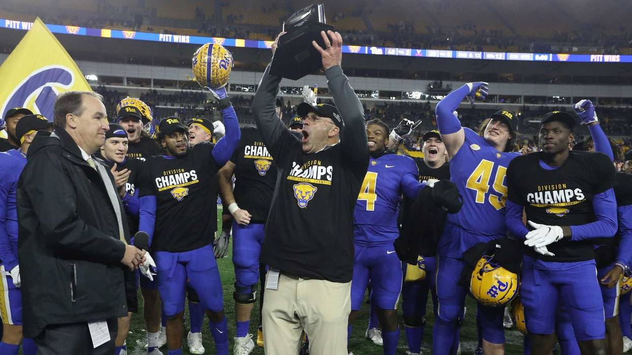 Pittsburgh Panthers head coach Pat Narduzzi celebrates with the ACC Coastal Division Championship trophy