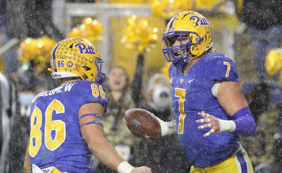 Pittsburgh Panthers tight end Lucas Krull (7) reacts with tight end Gavin Bartholomew (86) after Krull scored a touchdown against the North Carolina Tar Heels in overtime at Heinz Field. Pittsburgh won 30-23 in overtime.