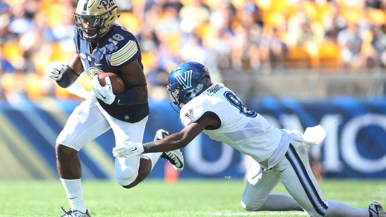 Pittsburgh Panthers wide receiver Dontez Ford runs after a pass reception against Villanova Wildcats defensive back Trey Johnson. Johnson sued the NCAA Wednesday over student athlete pay.