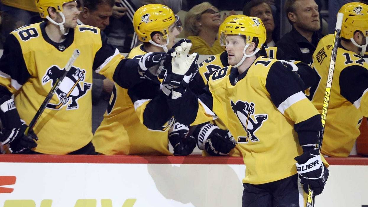 Pittsburgh Penguins center Jared McCann (19) celebrates his goal with the Pens bench against the Florida Panthers during the first period at PPG PAINTS Arena.
