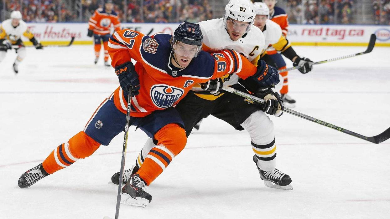 Pittsburgh Penguins forward Sidney Crosby (87) tries to check Edmonton Oilers forward Connor McDavid (97) during the first period at Rogers Place.
