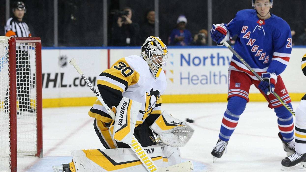 Pittsburgh Penguins goalie Matt Murray makes a save in front of New York Rangers left wing Jimmy Vesey