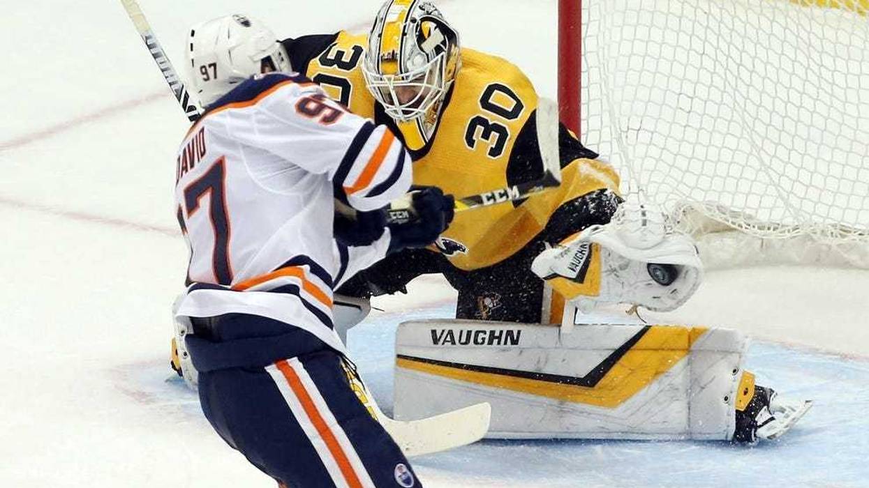 Pittsburgh Penguins goaltender Matt Murray (30) makes a save on a penalty shot by Edmonton Oilers center Connor McDavid (97) during the second period at PPG PAINTS Arena.