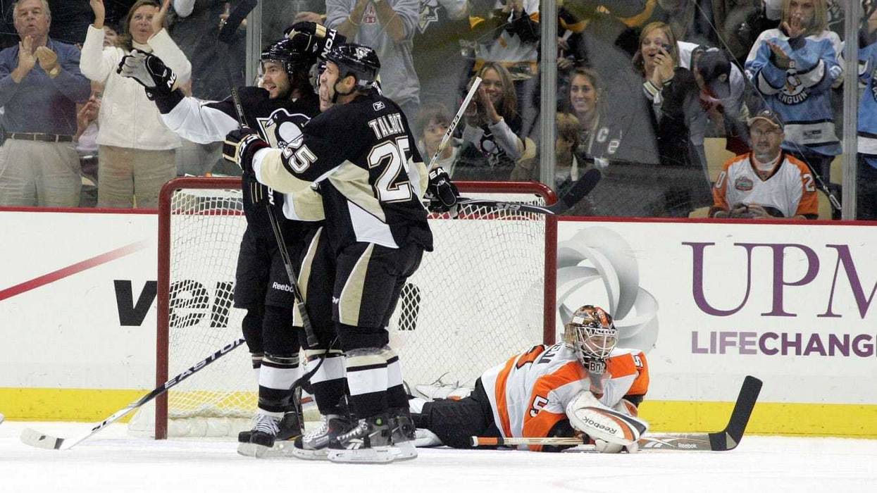 Pittsburgh Penguins Kris Letang (58) and Max Talbot (25) celebrate scoring in front of Philadelphia Flyers goalie Sergei Bobrovsky (35) during the first period at the CONSOL Energy Center.