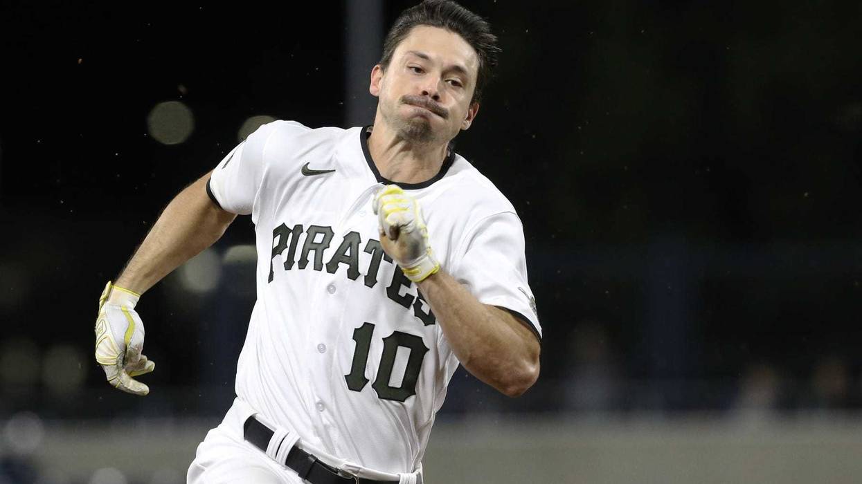 Pittsburgh Pirates center fielder Bryan Reynolds (10) runs to third base with an RBI triple