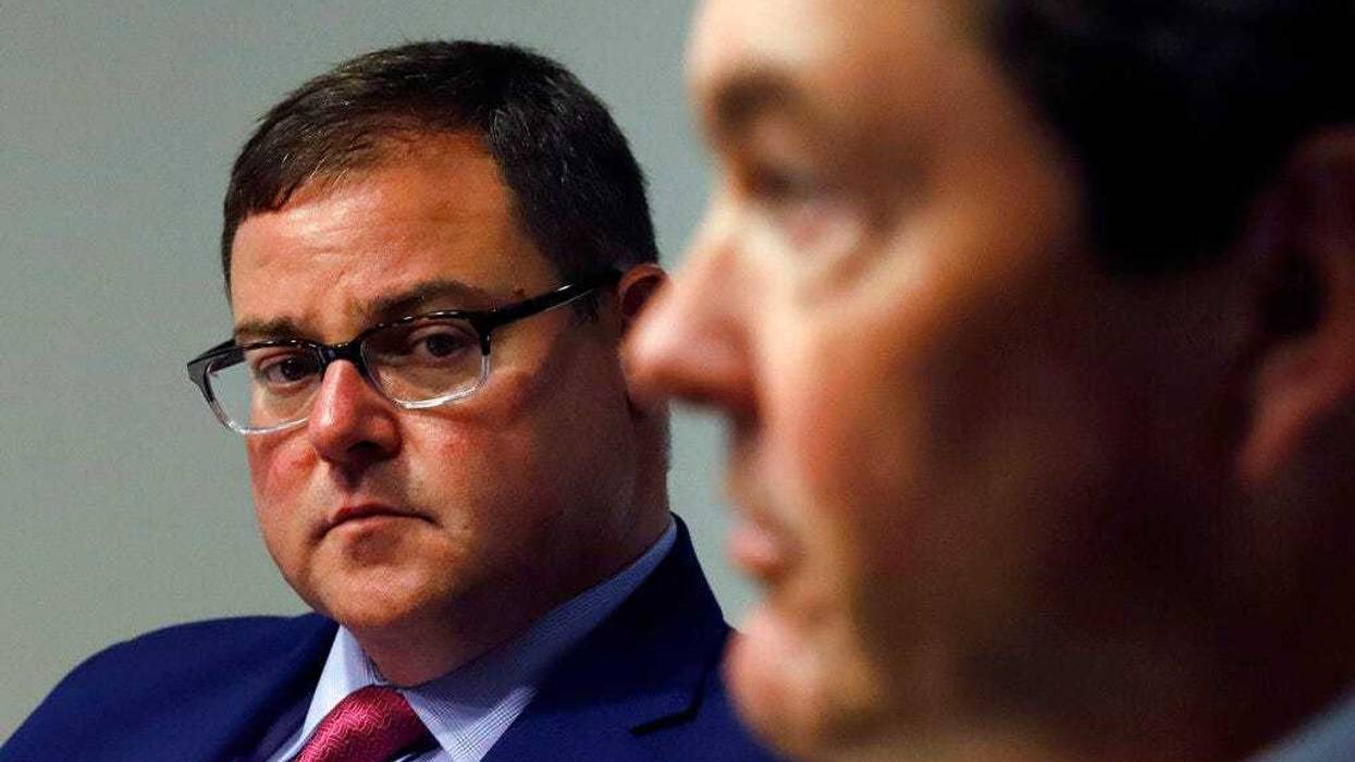 Pittsburgh Pirates Chairman of the Board Bob Nutting, right, meets with reporters to introduce Travis Williams, left, as the team's new president