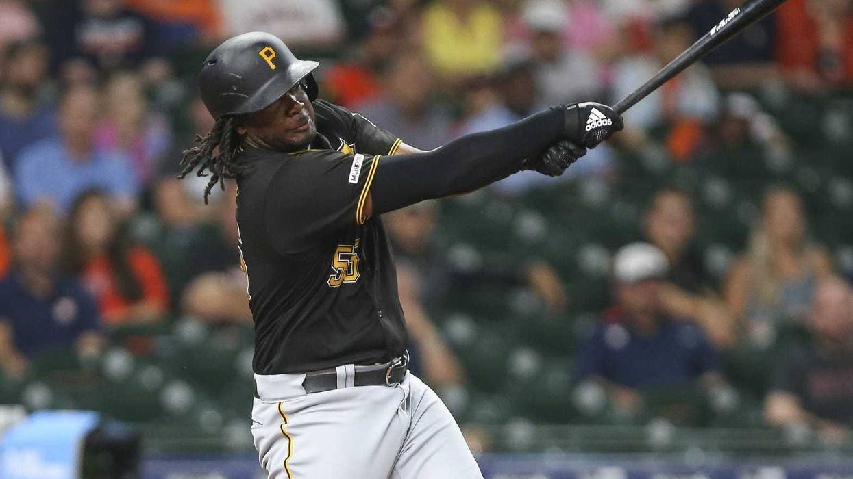 Pittsburgh Pirates designated hitter Josh Bell (55) hits a home run during the first inning against the Houston Astros at Minute Maid Park.