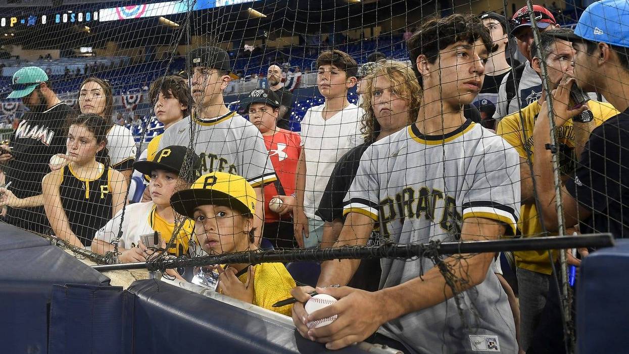 Pittsburgh Pirates fans watch their team warm up before playing the Miami Marlins,