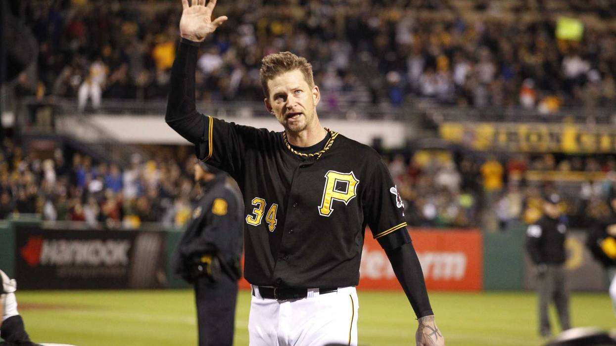 Pittsburgh Pirates starting pitcher A.J. Burnett (34) reacts to the crowd as he takes a curtain call