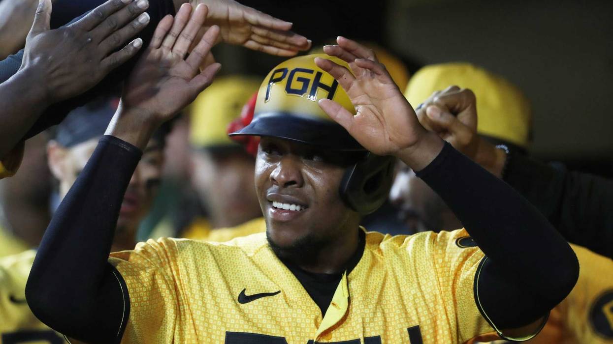 Pittsburgh Pirates third baseman Ke'Bryan Hayes (13) celebrates in the dugout after scoring a run against the New York Yankees
