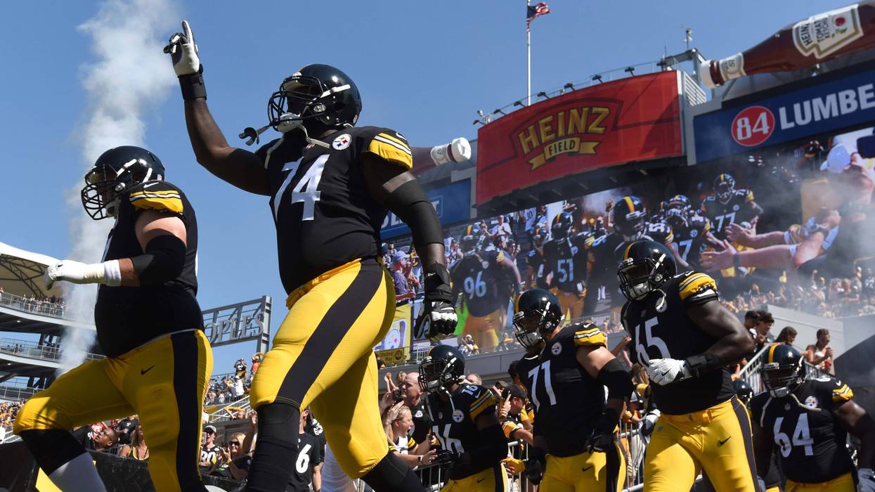 Pittsburgh Steelers guard Chris Hubbard (74) points to the sky as he takes the field to play the Atlanta Falcons at Heinz Field.