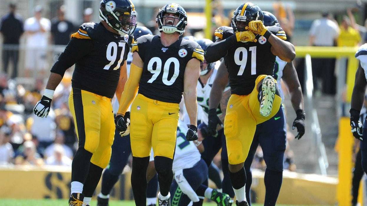 Pittsburgh Steelers linebacker T.J. Watt (90) celebrates a sack of Seattle Seahawks quarterback Russell Wilson (3) with teammates Cameron Heyward (97) and Stephon Tuitt (91)