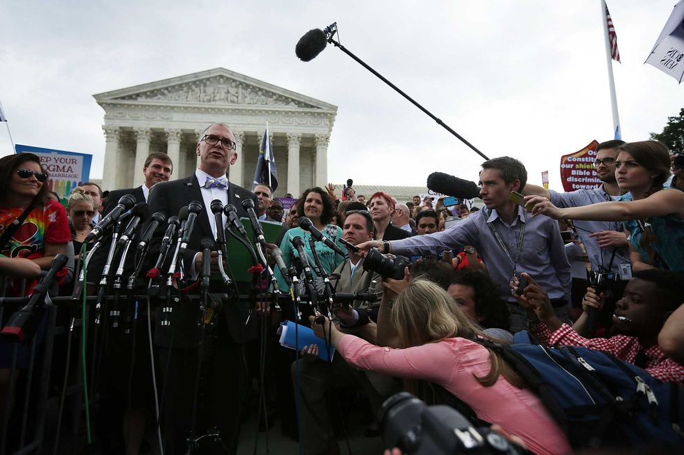 Plaintiff Jim Obergefell speaks to members of the media after the U.S. Supreme Court handed down a ruling legalizing same-sex marriage June 26, 2015 outside the Supreme Court in Washington, DC. The bow tie Obergefell is wearing in the photo will be on display at the Obama Presidential Center next year.