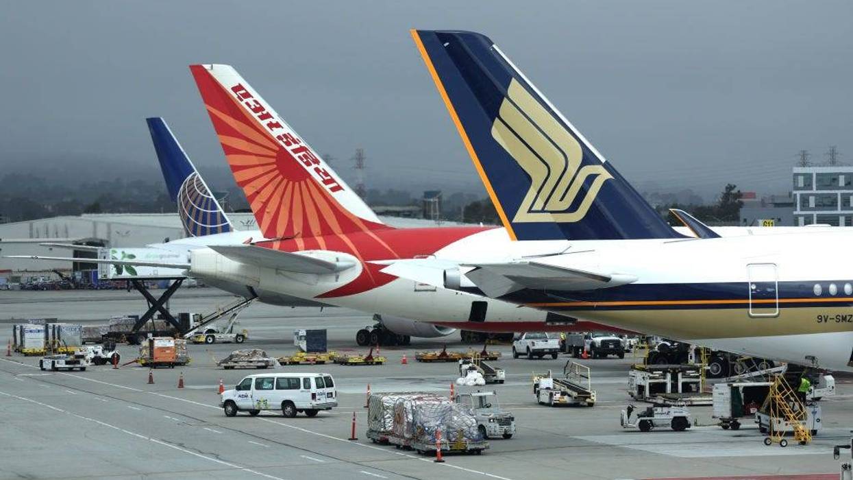 Planes sit parked at their gates at San Francisco International Airport on July 01, 2022 in San Francisco, California.