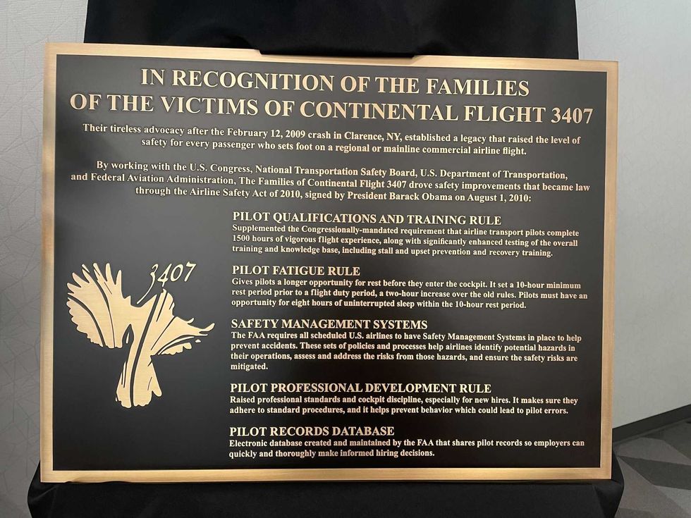 Plaques honoring victims of the crash of Flight 3407 and family members fighting to make airlines safer.