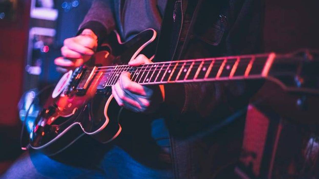 playing the electric guitar