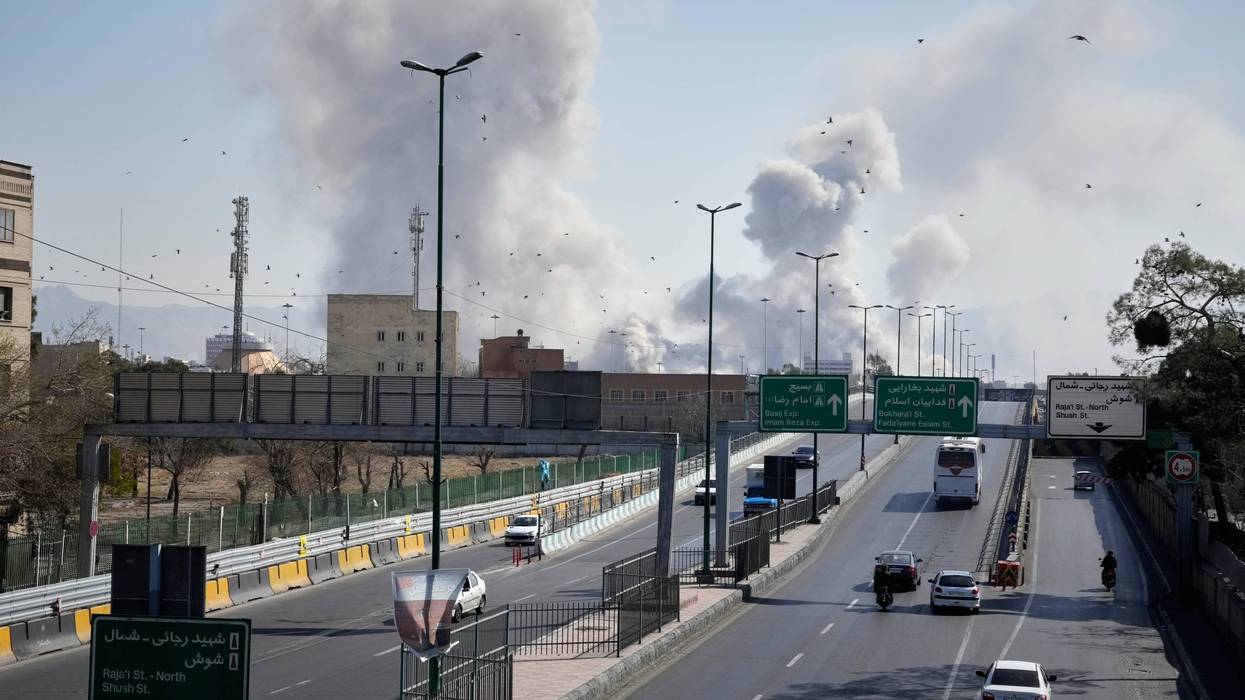 Plumes of smoke rise as strikes hit the city during the U.S.–Israeli military campaign in Tehran, Iran, Thursday, March 5, 2026.