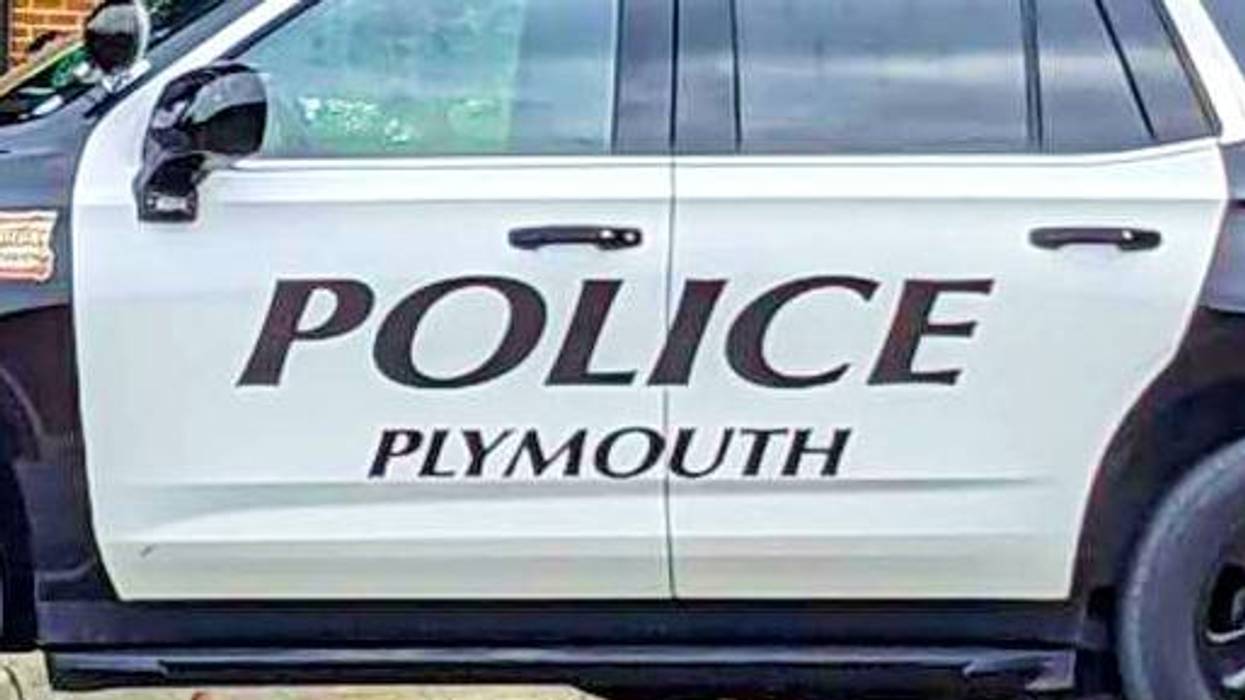 Plymouth Police car side, black and white, with 'POLICE PLYMOUTH' on the door.