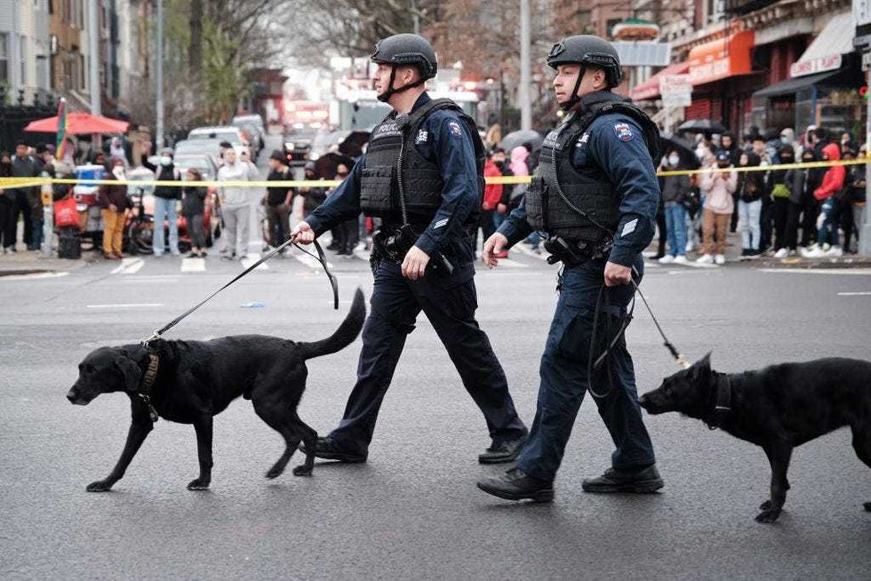 Police and emergency responders gather at the site of a reported shooting of multiple people outside of the 36 St subway station on April 12, 2022 in the Brooklyn borough of New York City.