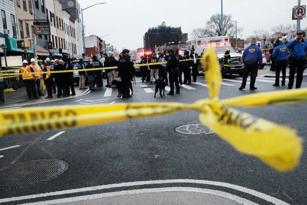 Police and emergency responders gather at the site of a reported shooting of multiple people outside of the 36 St subway station on April 12, 2022 in the Brooklyn borough of New York City